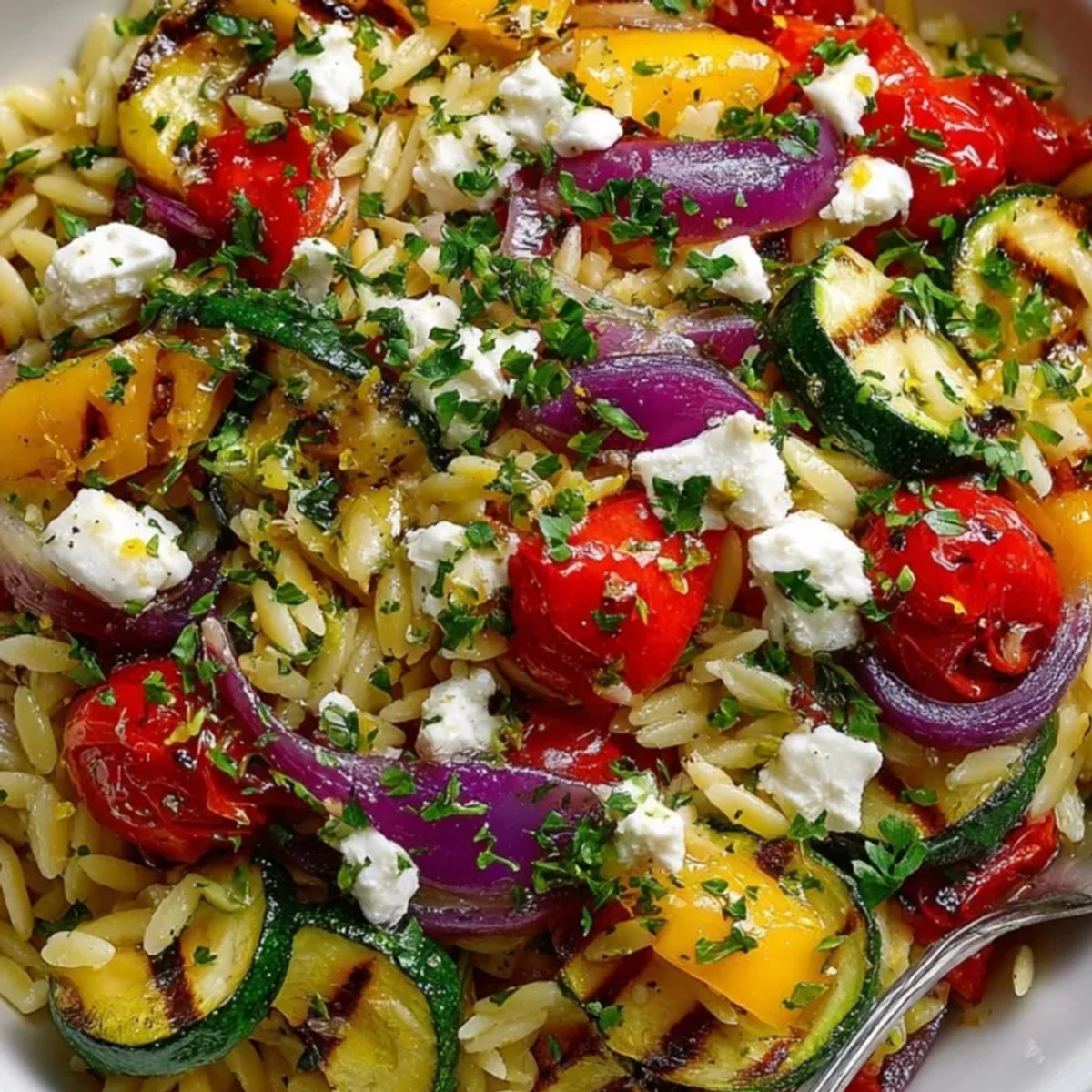 Roasted Orzo with Vegetables and Feta: A warm, colorful Mediterranean pasta salad.