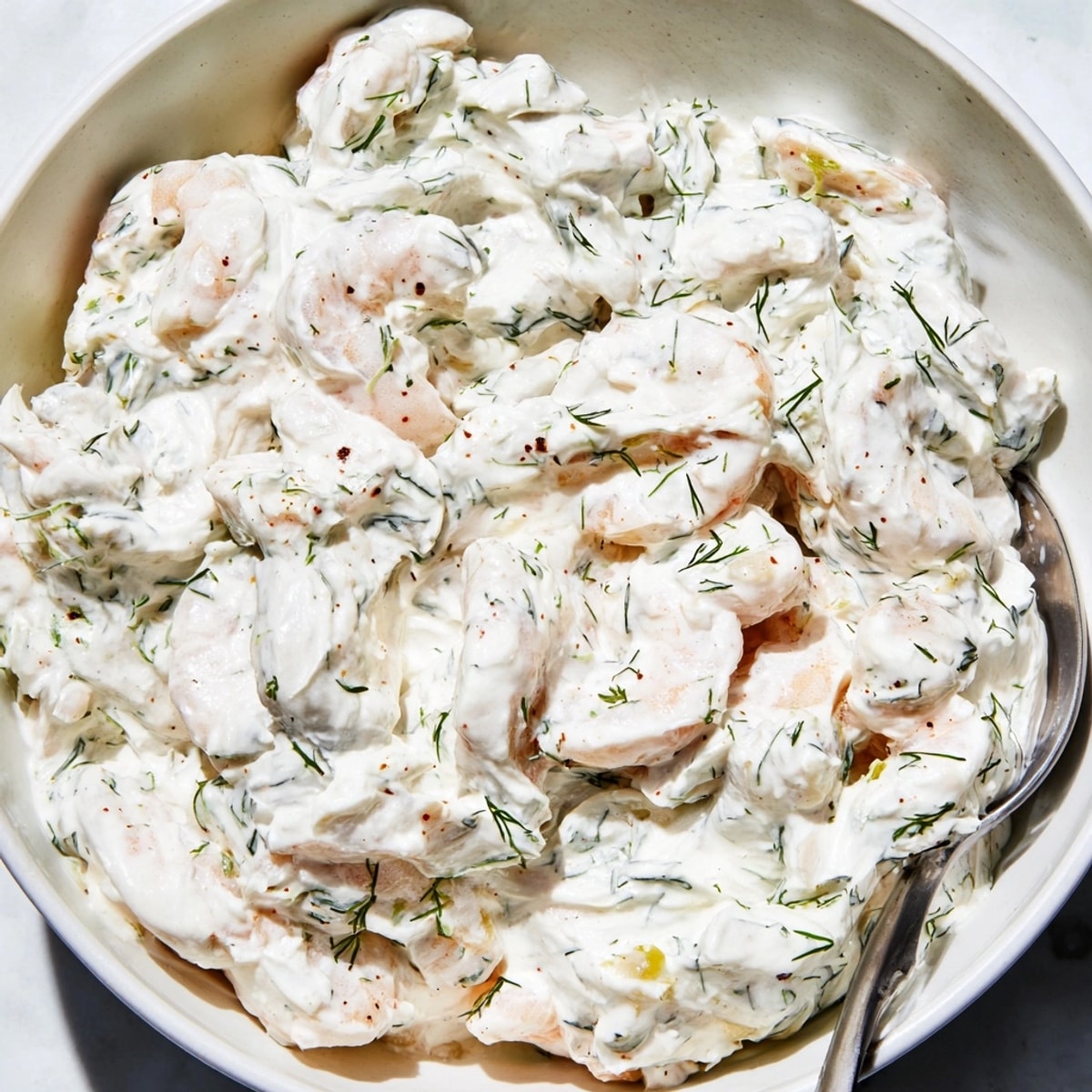Creamy Shrimp Dill Yogurt Dip, speckled with fresh herbs, ready to be served chilled.