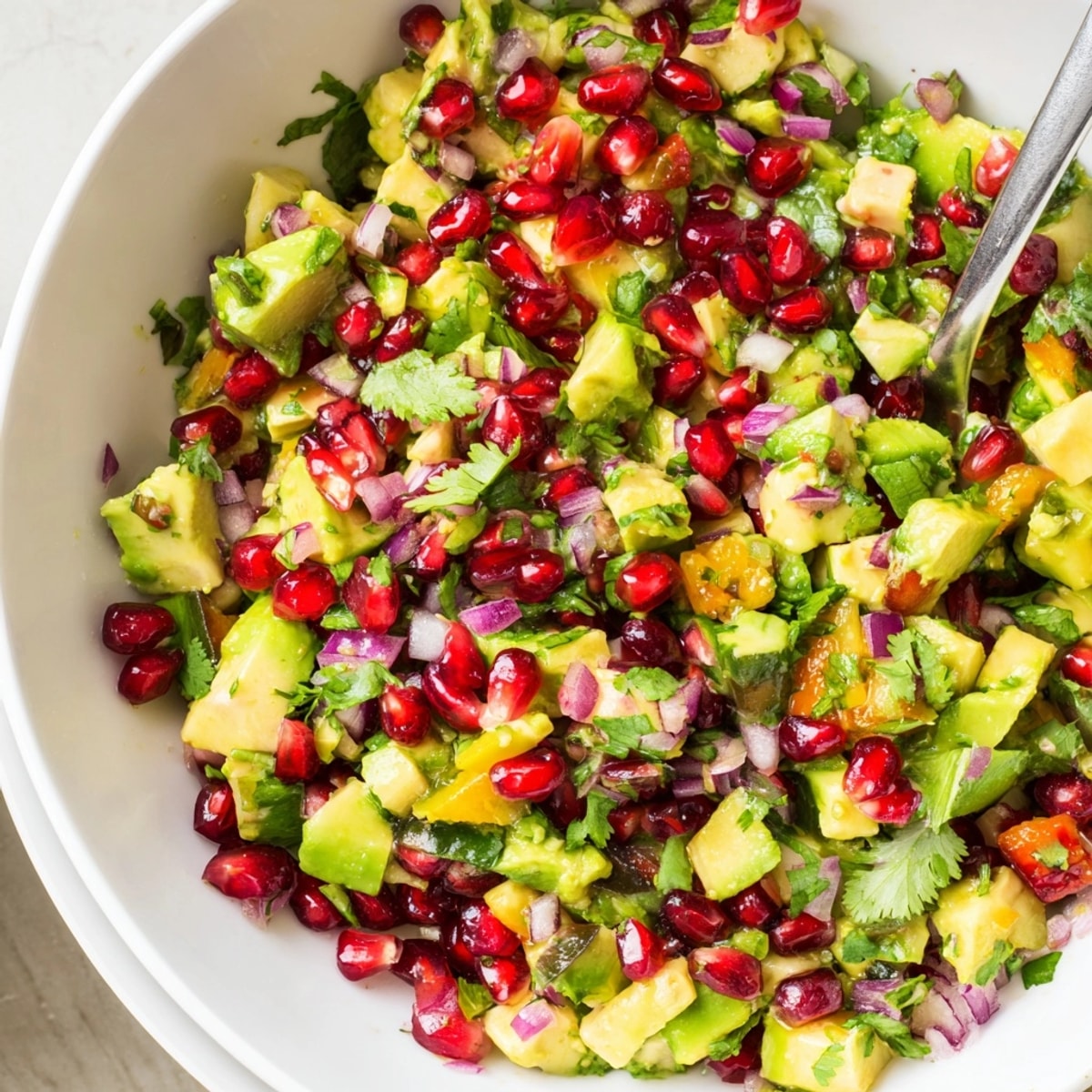 Festive Cranberry Jalape&#769;o Avocado Salsa: a sweet spicy appetizer for holiday gatherings glistening brightly.
