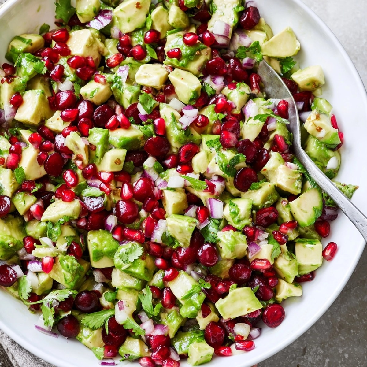 Creamy diced avocado and crimson cranberries create a delectable fresh Cranberry Jalape&#769;o Avocado Salsa.