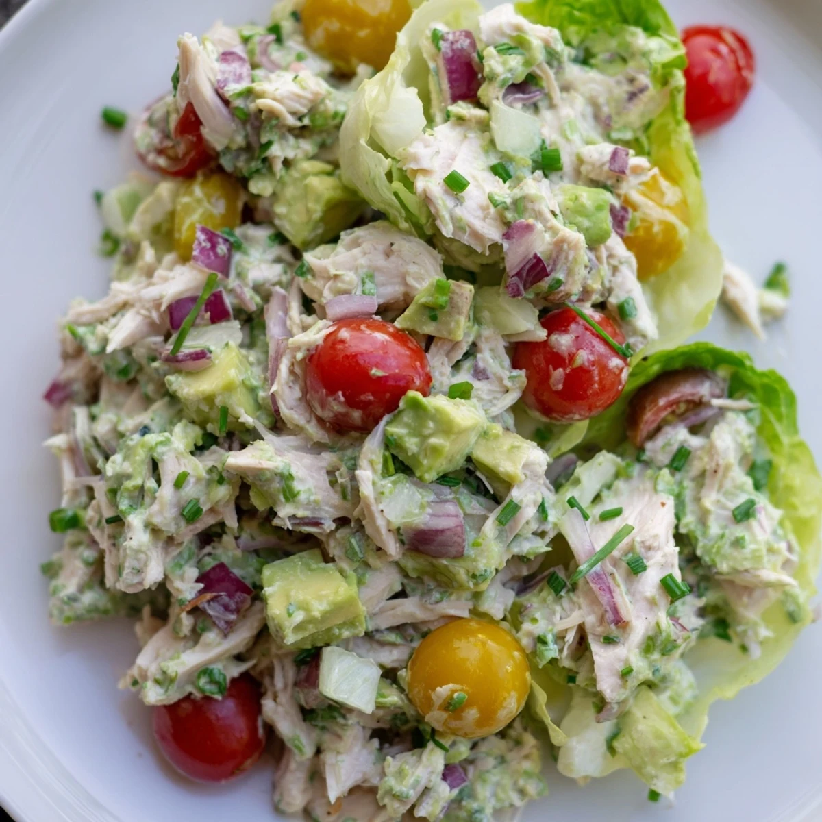 Creamy Avocado Ranch Chicken Salad Cups served in crisp lettuce leaves.  