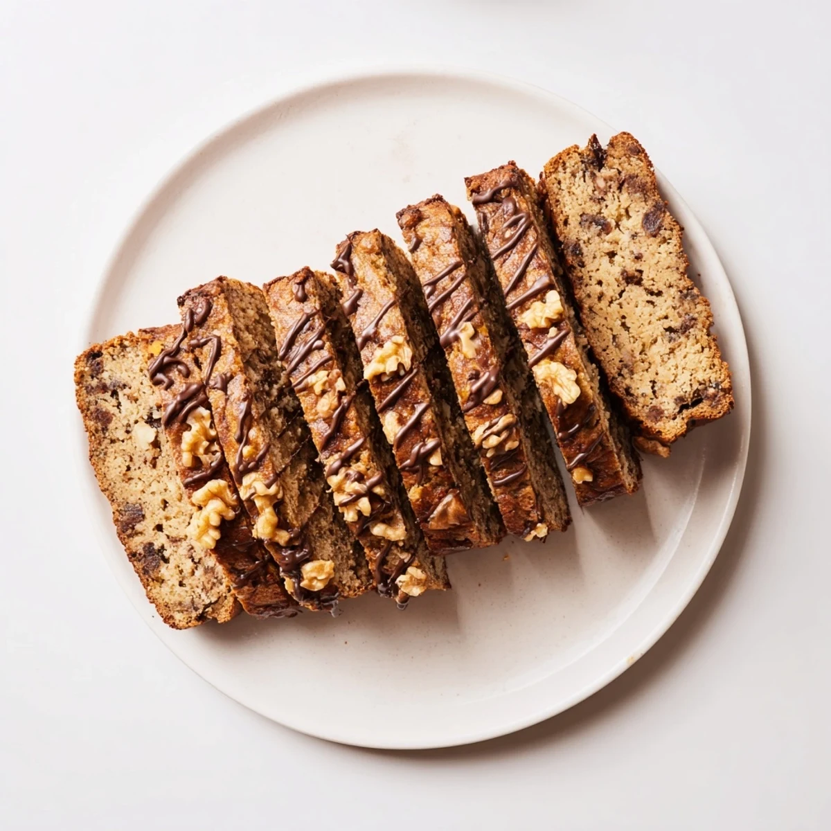 Golden banana bread infused with coffee flavors, ideal for afternoon tea or coffee.