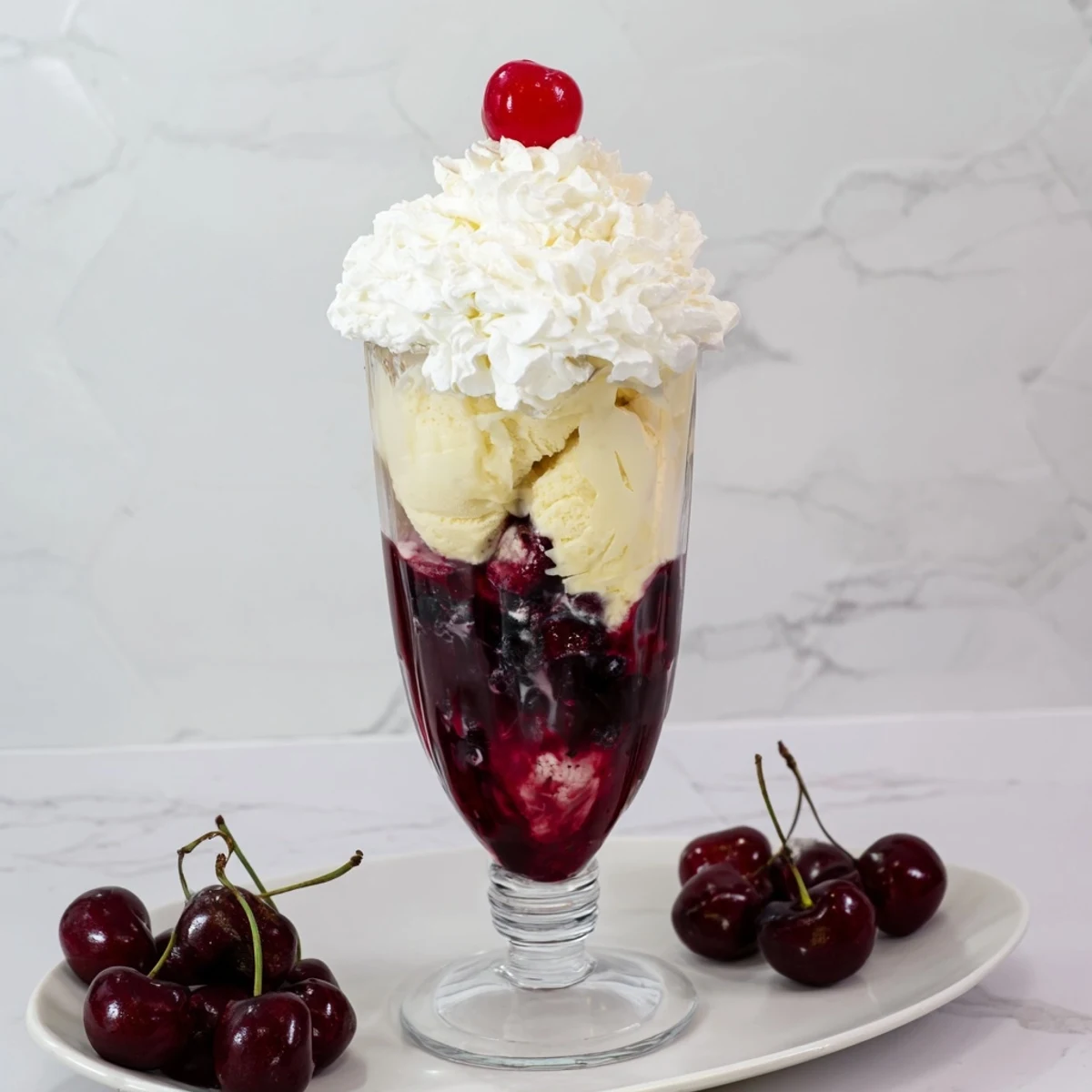 Indulge in a tall glass of Homemade Fruit Soda Floats, a refreshing treat bright red with cherry flavor.