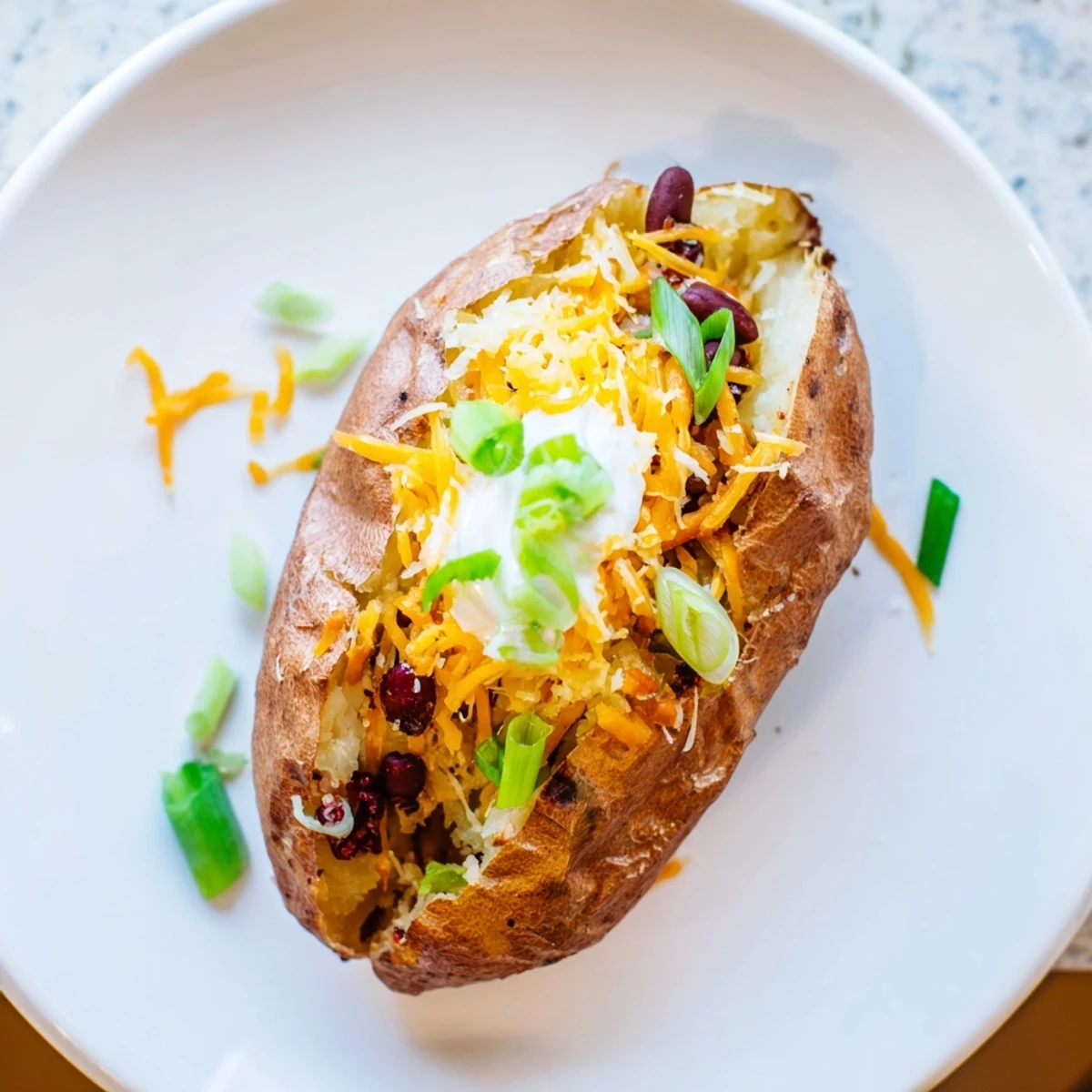 A beautiful spread of topping choices for building the perfect loaded baked potato bar.