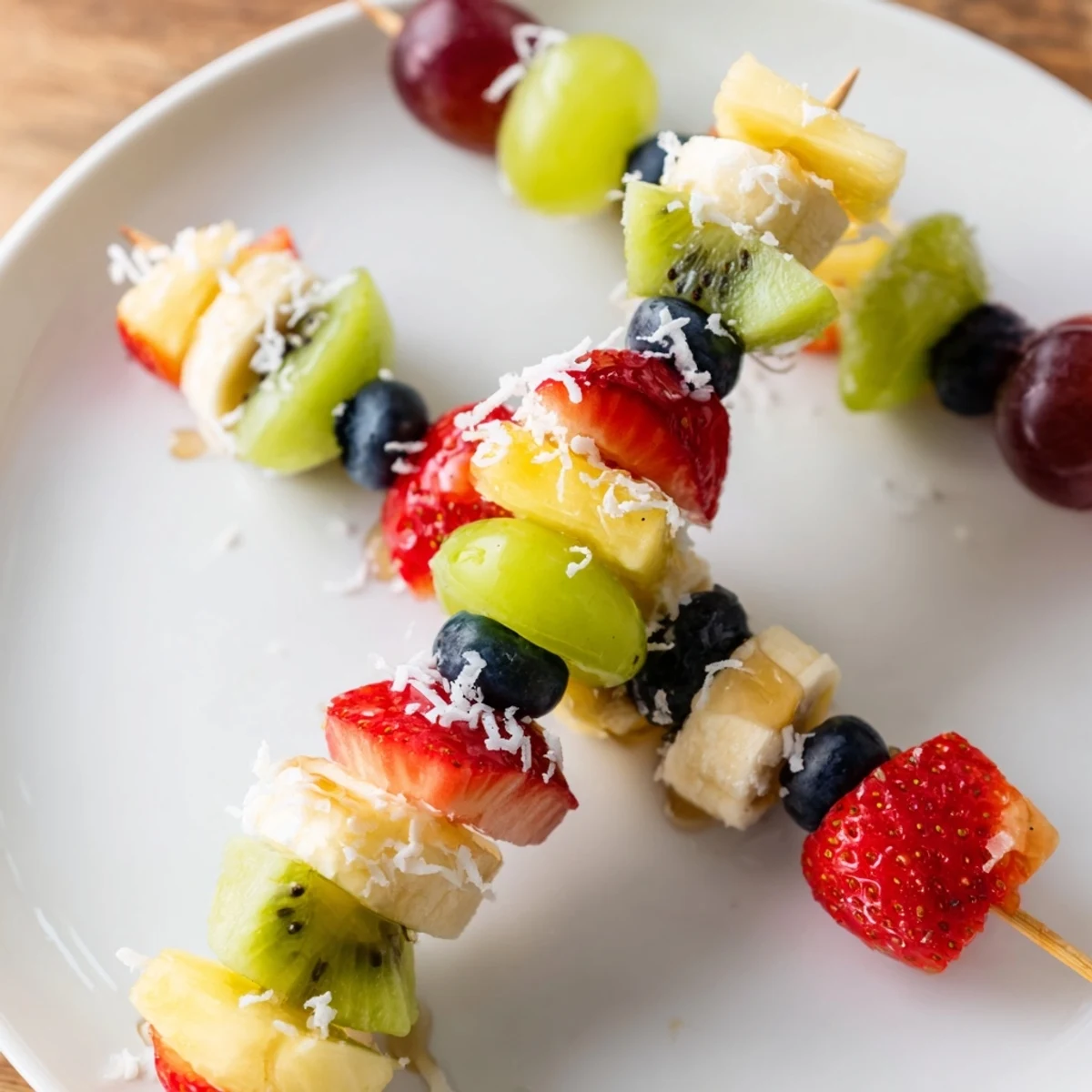 Festive fruit kabobs image: Colorful skewers of strawberries, grapes, and pineapple, a delightful and refreshing treat.