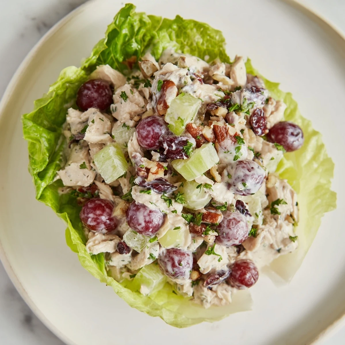 Bright and colorful festive chicken salad cups made with fresh fruit and crunchy pecans.