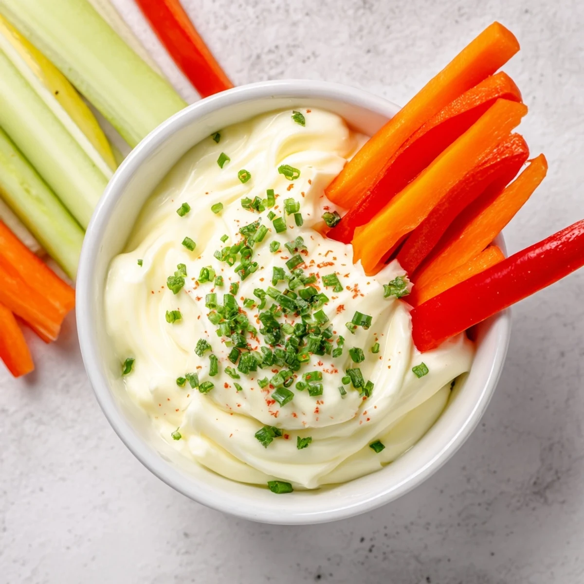 Kids Dip features a cool, refreshing presentation of ranch-flavored cream cheese with colorful sticks.