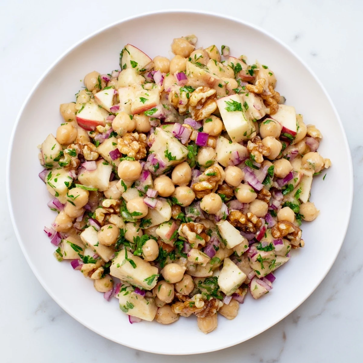 See the beautiful Fall Harvest Apple and Chickpea Salad, with crisp apples, for a light and healthy meal.