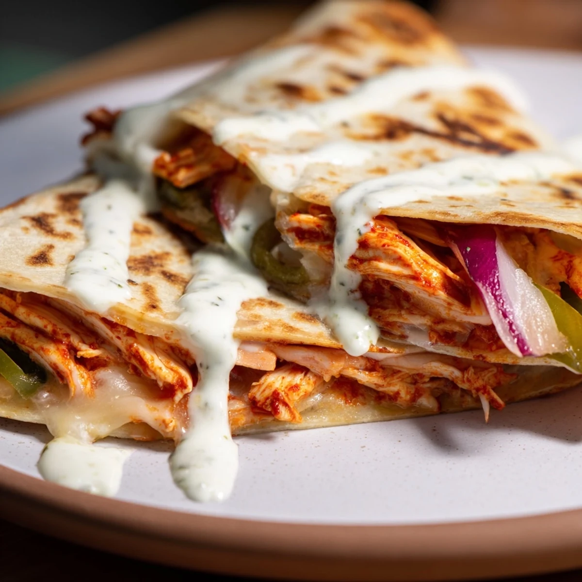 Warm, cheesy Tandoori Chicken Quesadilla oozing a savory filling, perfect for a quick and satisfying meal.