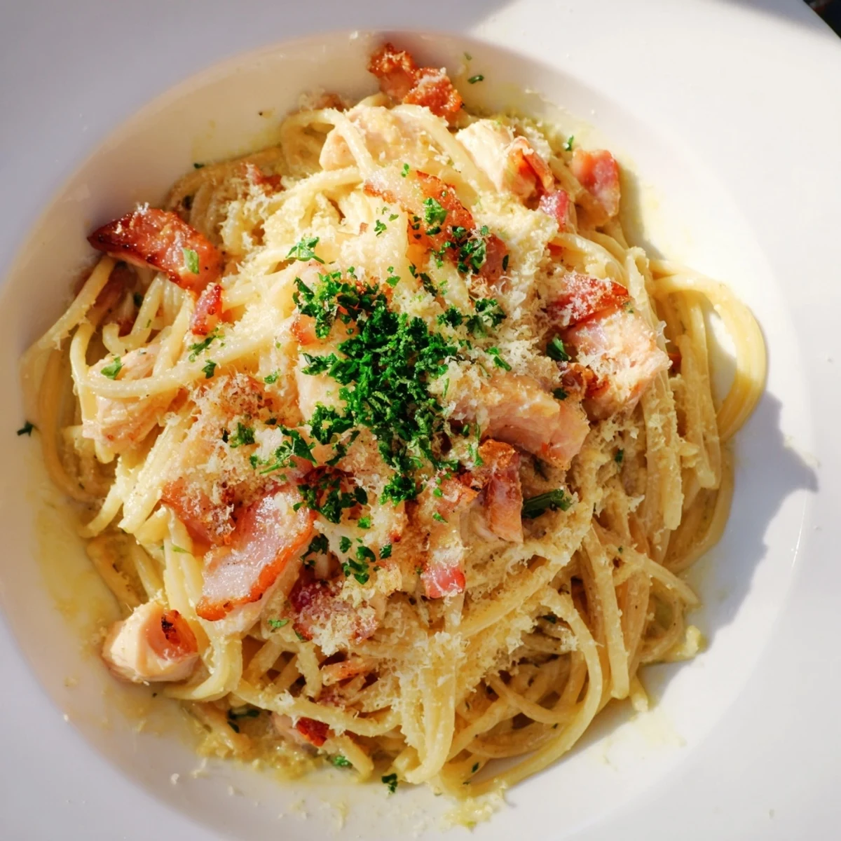 Creamy Chicken Carbonara dish with visible bacon bits, perfect for a comforting Italian dinner.