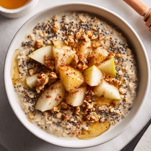 A bowl of mashed cauliflower with roasted garlic and herbs.