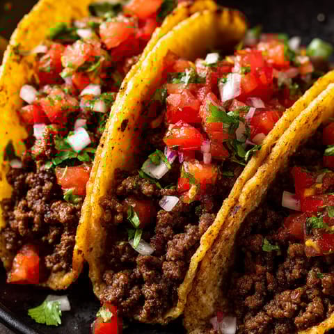 Two beef tacos with fresh salsa.