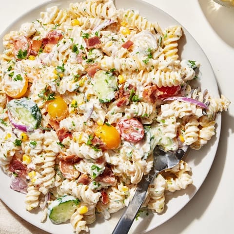 Savory pasta salad with smoky bacon and tangy ranch drizzled in rich Alfredo sauce.  