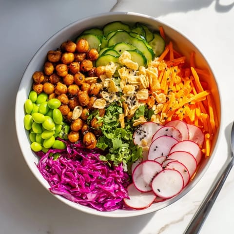 Colorful ASMR Crunch Snack Bowls topped with crunchy chickpeas and seeds for delightful snacking.  