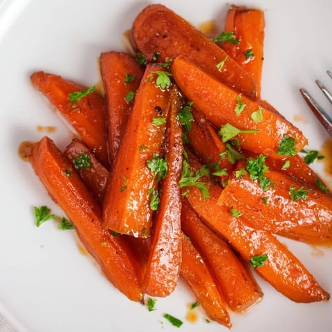 Sweet and savory bourbon maple glazed carrots, perfect for festive gatherings.  