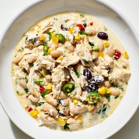 A close-up of a flavorful, creamy Slow Cooker White Chicken Chili ready to be served.