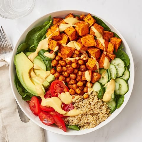 Wholesome Sweet Potato & Chickpea Buddha Bowl brimming with fresh veggies and crispy chickpeas.  