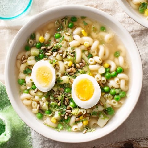 Rich and colorful Ramen Upgrade with Frozen Peas, featuring vibrant peas and savory broth in a bowl.