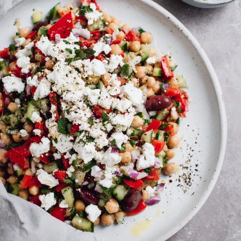 Freshly assembled Mediterranean Chickpea and Feta Bowl, a hearty vegan meal bursting with flavor and textures.