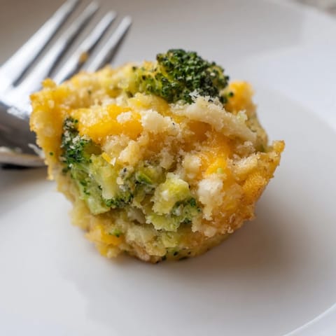 These savory Cheesy Broccoli Casserole Bites, filled with melted cheese, look delicious and smell amazing right from the oven.