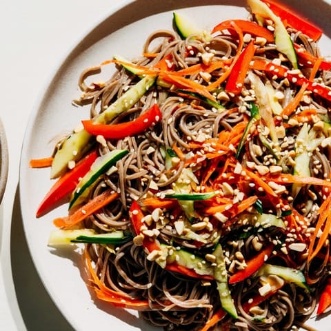 Chilled Cold Noodle Salad with Sesame-Ginger Dressing: a colorful mix featuring crunchy veggies.