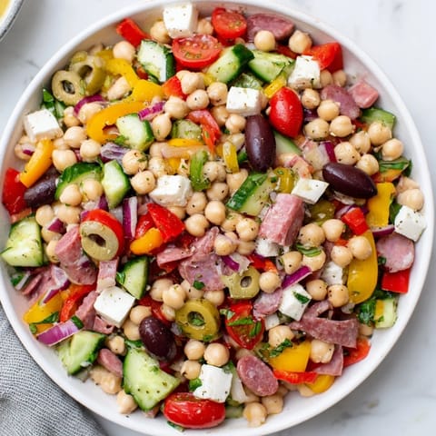 A refreshing close-up showcases this Crunchy Antipasto Chopped Salad, perfect as a light lunch or flavorful appetizer.