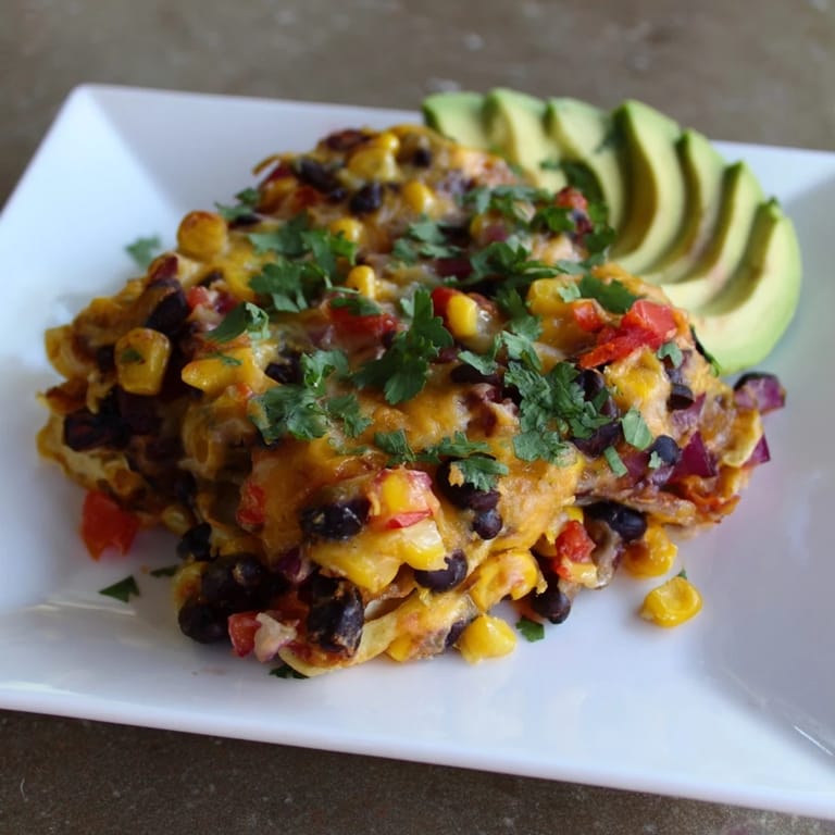 A hearty, vegetarian Quick Black Bean and Corn Tortilla Casserole, perfectly baked, promising a satisfying weeknight meal.