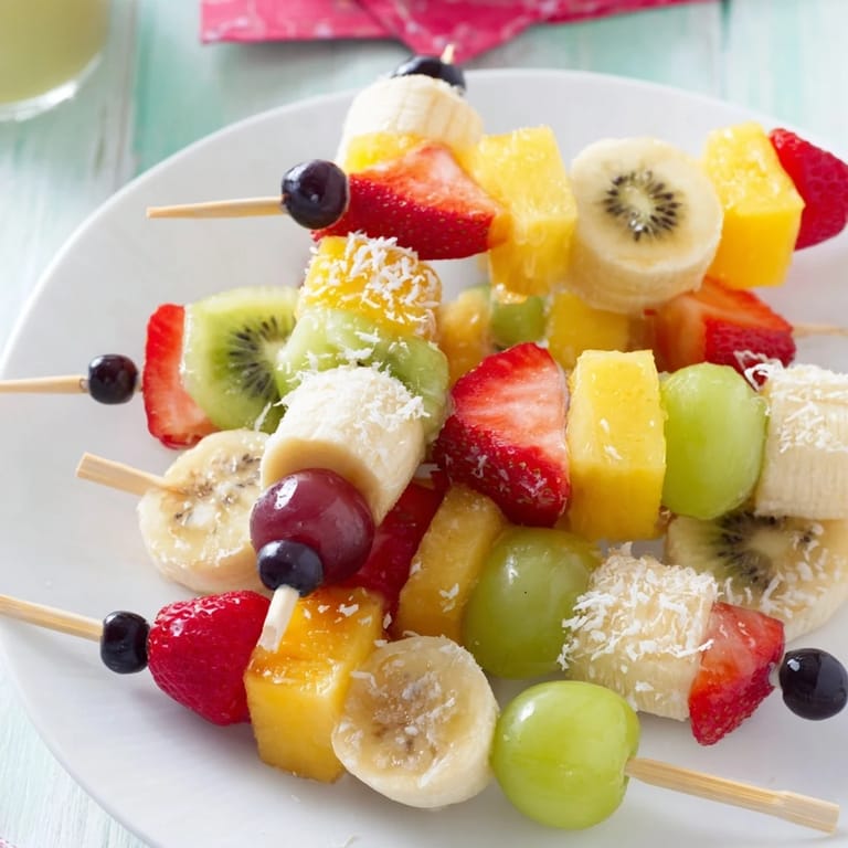 Sweet and juicy Easy Festive Fruit Kabobs, beautifully presented for a healthy dessert option.