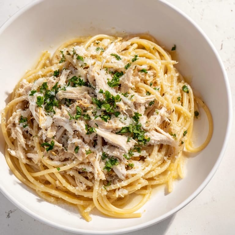 A close-up of Simple Garlic Butter Bucatini, where fragrant garlic and tender chicken star.