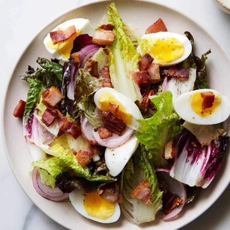 Fresh and flavorful Bitter Greens Salad with Warm Bacon Dressing, ready for a delicious meal.