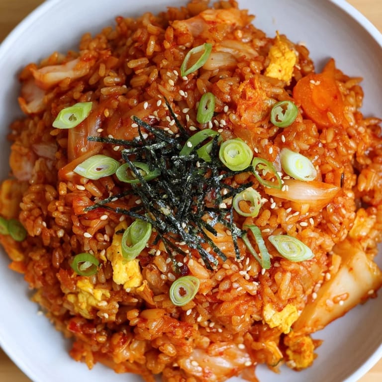 Flavorful Korean kimchi fried rice, served hot, showcasing the vibrant colors and aromas of the dish.