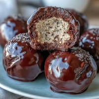 1. Vegan chocolate peanut butter protein balls with oats and cocoa, rolled into bite-sized energy snacks.  